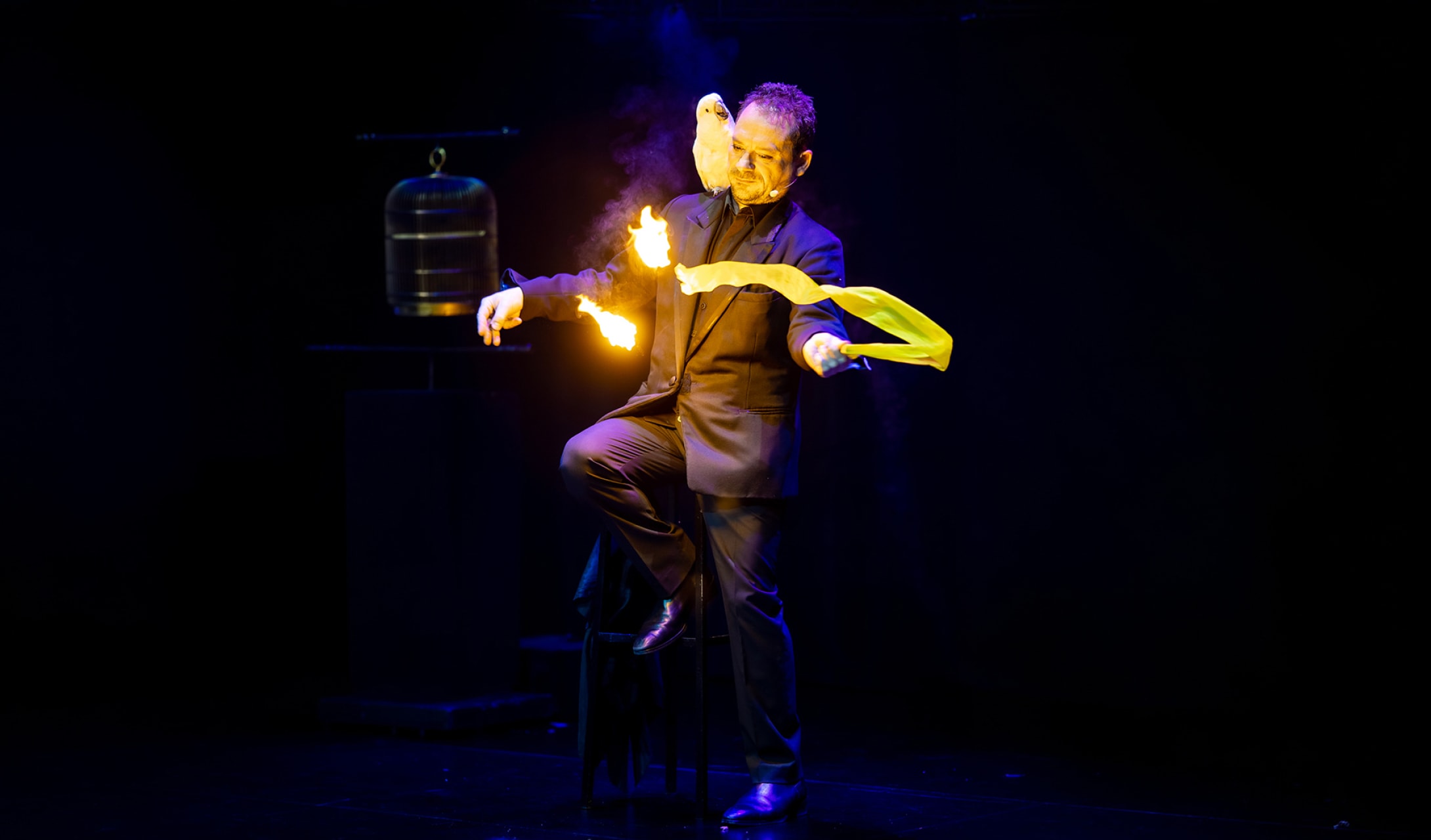 Magician performing with fire at a company party