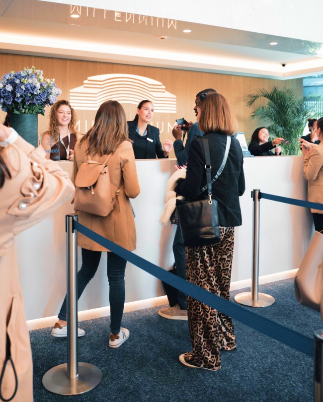 Millennium hostesses welcoming visitors at the reception desk