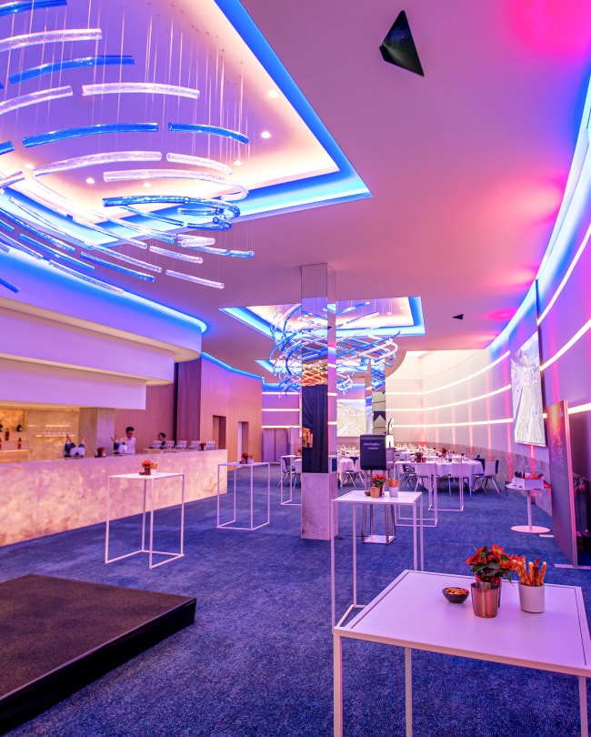 The Space set up for a company party: video screens, bar and mood lighting