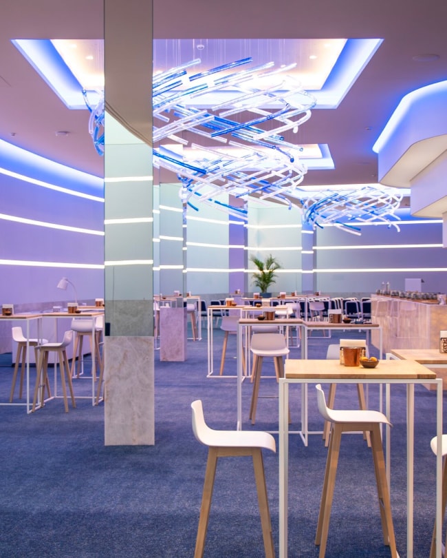The Space arranged with high tables and stools for a cocktail reception