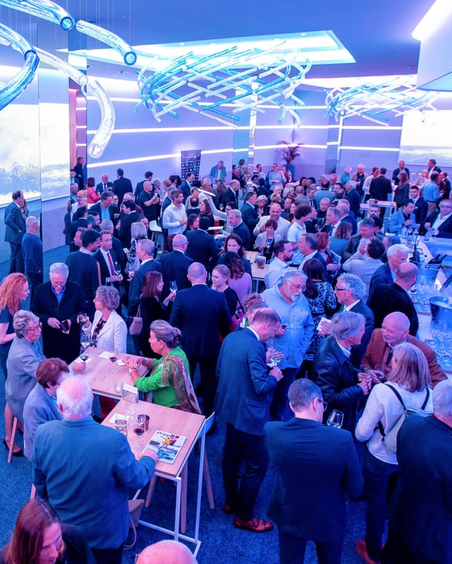 Standing reception in The Space seen from above, crowd and light sculptures