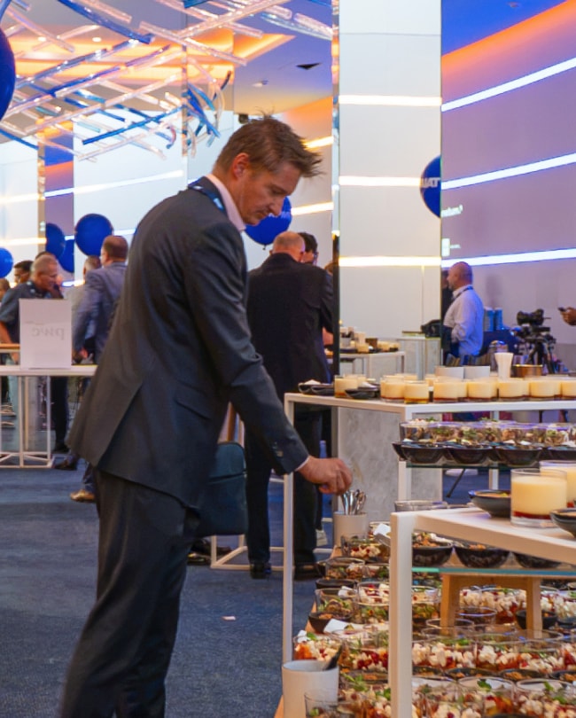 Congress attendee serving himself at the buffet in The Space during the break